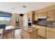 Well-lit kitchen features an island, built in oven, and access to the patio at 13227 N Mimosa Dr # 107, Fountain Hills, AZ 85268