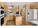Well-equipped kitchen with stainless steel appliances, granite countertops, and tiled flooring at 13227 N Mimosa Dr # 107, Fountain Hills, AZ 85268