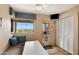 Bright kitchen featuring breakfast nook with view window, storage closet, and access to the patio at 13227 N Mimosa Dr # 107, Fountain Hills, AZ 85268