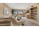 Bright living room with a sliding glass door, plush seating, and tv at 13227 N Mimosa Dr # 107, Fountain Hills, AZ 85268