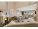 Comfortable living room with high ceilings, a fireplace, and sliding glass doors at 13227 N Mimosa Dr # 107, Fountain Hills, AZ 85268