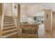 Inviting living room with a fireplace and stairs leading to the upper level at 13227 N Mimosa Dr # 107, Fountain Hills, AZ 85268