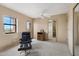 Bright and airy bedroom with a comfortable chair, fan, and view of the outdoors at 13227 N Mimosa Dr # 107, Fountain Hills, AZ 85268