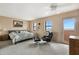 Bright bedroom featuring a spacious layout, soft carpet, and outdoor access at 13227 N Mimosa Dr # 107, Fountain Hills, AZ 85268