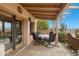 Inviting covered patio with terracotta tile flooring, seating, and mountain views at 13227 N Mimosa Dr # 107, Fountain Hills, AZ 85268