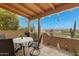 Charming patio area with seating, lush greenery, and mountain views at 13227 N Mimosa Dr # 107, Fountain Hills, AZ 85268