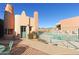 Community pool area with desert-inspired architecture and green door at 13227 N Mimosa Dr # 107, Fountain Hills, AZ 85268