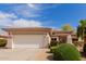 Charming single-story home featuring a two-car garage and well-manicured landscaping at 13312 W Edgemont Ave, Goodyear, AZ 85395