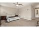 Neutral bedroom with carpet flooring, a ceiling fan, and ample natural light at 13603 W Remuda Dr, Peoria, AZ 85383