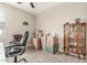 Bedroom featuring neutral walls and carpet, and a classic wooden cabinet, partially filled with packing boxes at 13603 W Remuda Dr, Peoria, AZ 85383