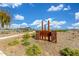 Rancho Caballo community park featuring lush greenery, walking path and shaded ramada under a sunny blue sky at 13603 W Remuda Dr, Peoria, AZ 85383