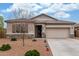 Charming single-story home with a stone accent, desert landscaping, and a two-car garage at 13603 W Remuda Dr, Peoria, AZ 85383