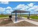 Inviting picnic area with covered seating and a grill, perfect for outdoor gatherings and community events at 13603 W Remuda Dr, Peoria, AZ 85383