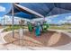 Community playground with sunshade features slides and climbing structures, offering fun and safe outdoor activities at 13603 W Remuda Dr, Peoria, AZ 85383