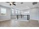 Bright bonus room featuring high ceilings, lots of windows, wood-look tile and black metal railing at 1372 N Zane Dr, Chandler, AZ 85226
