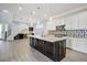 Open kitchen with an island, stainless appliances, and bar, ideal for entertaining at 1372 N Zane Dr, Chandler, AZ 85226