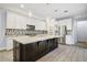 Stylish kitchen featuring a large island, stainless steel appliances, and decorative backsplash at 1372 N Zane Dr, Chandler, AZ 85226