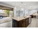 Open kitchen featuring a spacious island, stainless appliances, and a view to the outdoor patio at 1372 N Zane Dr, Chandler, AZ 85226