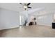 Spacious living area with stairs, a ceiling fan, and bar area with wine storage at 1372 N Zane Dr, Chandler, AZ 85226