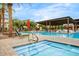 Resort-style pool area with shaded cabanas, jacuzzi, and comfortable lounge chairs at 1372 N Zane Dr, Chandler, AZ 85226