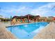 Stunning community pool area with ample seating and shaded pergola at 1372 N Zane Dr, Chandler, AZ 85226