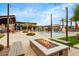 Relaxing community pool and fire pit area with comfortable seating under string lights at 1372 N Zane Dr, Chandler, AZ 85226