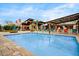 Inviting community splash pad and pool area with covered seating and play features at 1372 N Zane Dr, Chandler, AZ 85226
