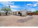 Charming home features a spacious backyard, covered patio, and a unique rock garden at 1510 E Wescott Dr, Phoenix, AZ 85024
