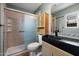 The contemporary bathroom includes an open shower, storage cabinet, and a stylish black sink at 1510 E Wescott Dr, Phoenix, AZ 85024