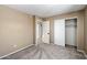 The bedroom features a closet, neutral paint, and access to an attached bathroom for convenience at 1510 E Wescott Dr, Phoenix, AZ 85024