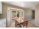 Bright dining area featuring a wooden table and a sliding glass door to backyard at 1510 E Wescott Dr, Phoenix, AZ 85024