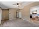 Comfortable living room with carpet flooring and adjacent dining area with access to kitchen at 1510 E Wescott Dr, Phoenix, AZ 85024