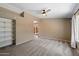 Inviting living room with carpet flooring and open shelving for storage and decor at 1510 E Wescott Dr, Phoenix, AZ 85024
