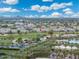 Aerial view of community with golf course, pools, and palm trees, highlighting resort-style amenities and prime location at 15221 N Clubgate Dr # 2061, Scottsdale, AZ 85254