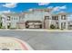 This is an exterior view of the home featuring covered parking, elevated entry, and elegant architectural details at 15221 N Clubgate Dr # 2061, Scottsdale, AZ 85254