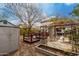 Landscaped backyard with raised garden beds and wooden gazebos, and a large shed at 1622 E Silverbirch Ave, Buckeye, AZ 85326