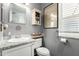 Charming bathroom featuring a mosaic-tiled vanity and decorative wall art at 1622 E Silverbirch Ave, Buckeye, AZ 85326