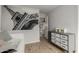Bedroom with light walls and hardwood floors and decorative artwork at 1622 E Silverbirch Ave, Buckeye, AZ 85326
