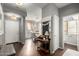 Inviting entryway with views to the dining room, bathroom, and front door at 1622 E Silverbirch Ave, Buckeye, AZ 85326