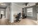 Spacious office featuring two work stations, modern wood floor, and a gray color palette at 1622 E Silverbirch Ave, Buckeye, AZ 85326