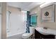 Bathroom features a shower and bathtub combo with stylish blue accents at 16624 E Palisades Blvd # 101, Fountain Hills, AZ 85268