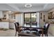 Dining room featuring a table and seating plus view of the modern kitchen area at 16624 E Palisades Blvd # 101, Fountain Hills, AZ 85268