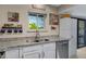 Bright kitchen featuring neutral countertops, stainless steel appliances, and modern faucet at 16624 E Palisades Blvd # 101, Fountain Hills, AZ 85268
