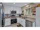 Bright kitchen features white cabinetry, stainless steel appliances and granite countertops at 16624 E Palisades Blvd # 101, Fountain Hills, AZ 85268