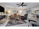 Comfortable living room featuring stylish decor, a ceiling fan and a view to the kitchen at 16624 E Palisades Blvd # 101, Fountain Hills, AZ 85268