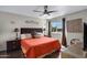 Comfortable bedroom with ceiling fan, side tables, decorative accents and natural light at 16624 E Palisades Blvd # 101, Fountain Hills, AZ 85268