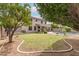 Expansive backyard with a pool, lush lawn, and mature trees provides a private retreat at 1805 E Sagebrush St, Gilbert, AZ 85296