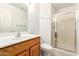 This bathroom features a wooden vanity and a glass enclosed shower at 1805 E Sagebrush St, Gilbert, AZ 85296