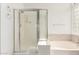 Bright bathroom featuring a glass enclosed shower and separate tub with tile surround at 1805 E Sagebrush St, Gilbert, AZ 85296