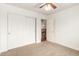 Bedroom with a ceiling fan, carpet, and a large closet at 1805 E Sagebrush St, Gilbert, AZ 85296